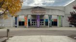 Vertical fabric banners with printed graphics on concrete pillars in Dayton, Ohio.