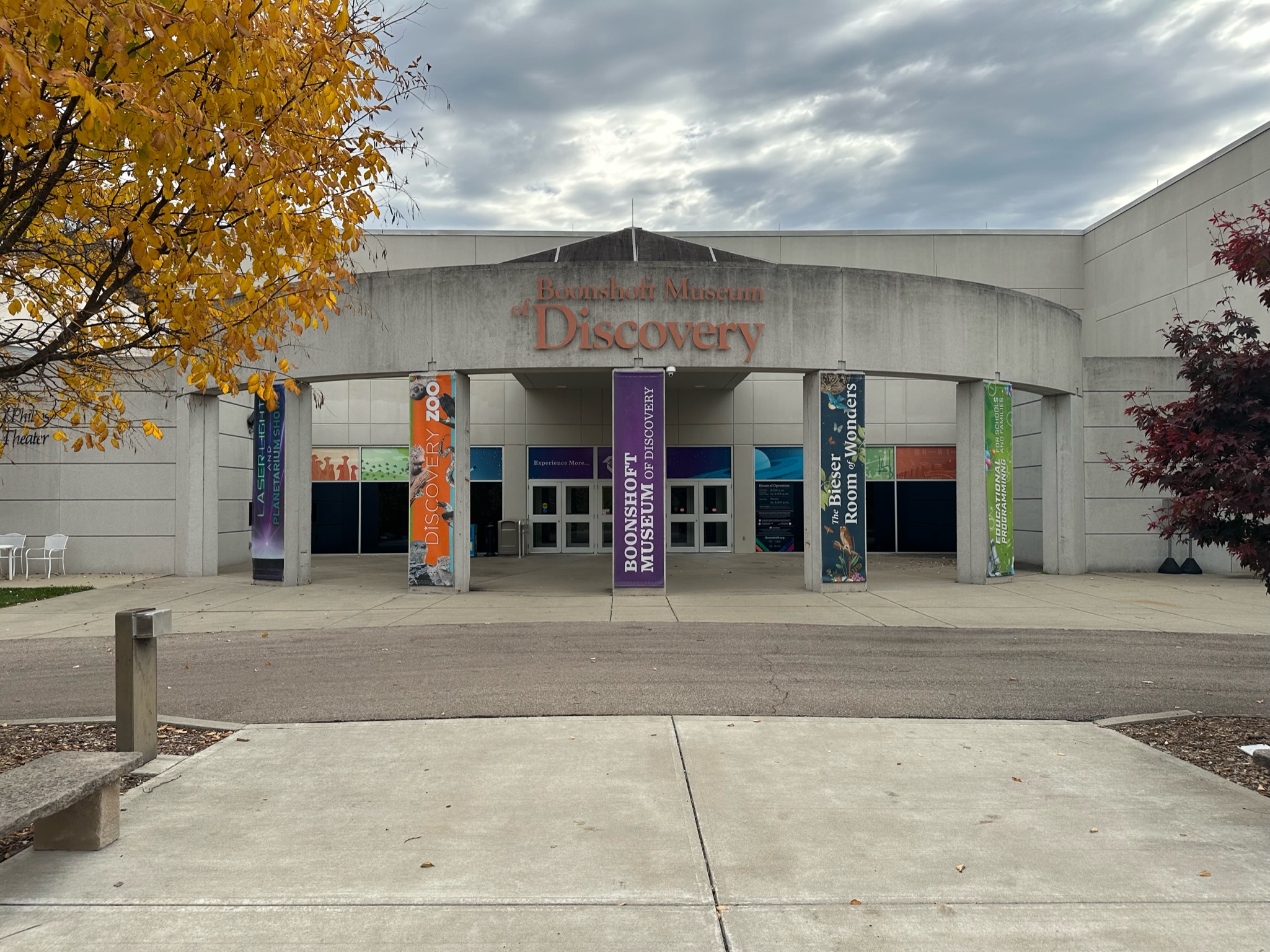 Vertical fabric banners with printed graphics on concrete pillars in Dayton, Ohio.