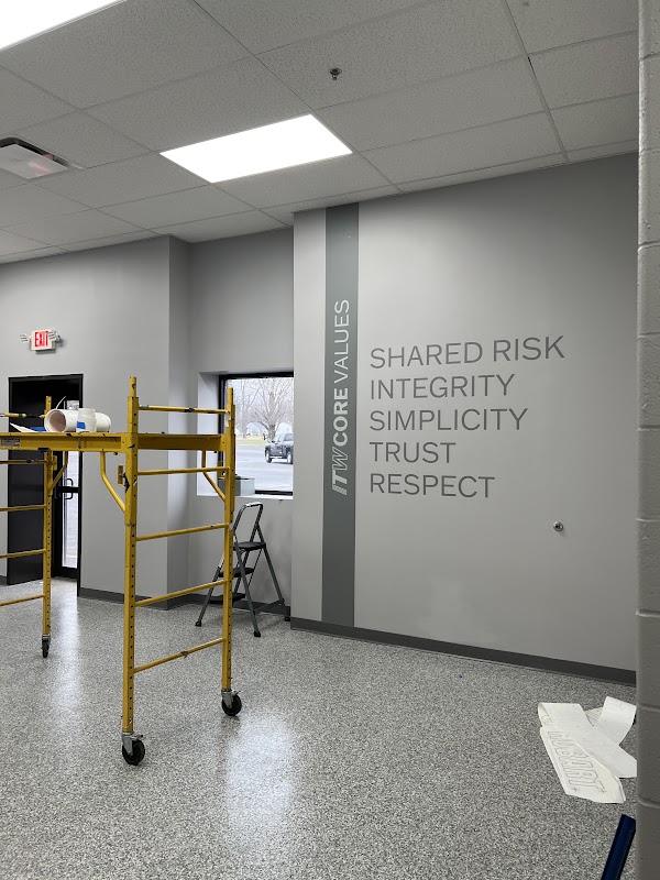 Vinyl wall graphics with text and vertical stripe in a commercial space in Dayton, Ohio.