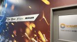 Frosted glass conference room door and large printed wall mural with arrow sign in Dayton, Ohio.