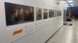 Long horizontal printed timeline panels with historical images and text in Dayton, Ohio.
