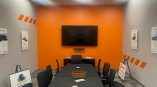Rectangular wall signs with printed graphics and a flat screen TV in Dayton, Ohio.