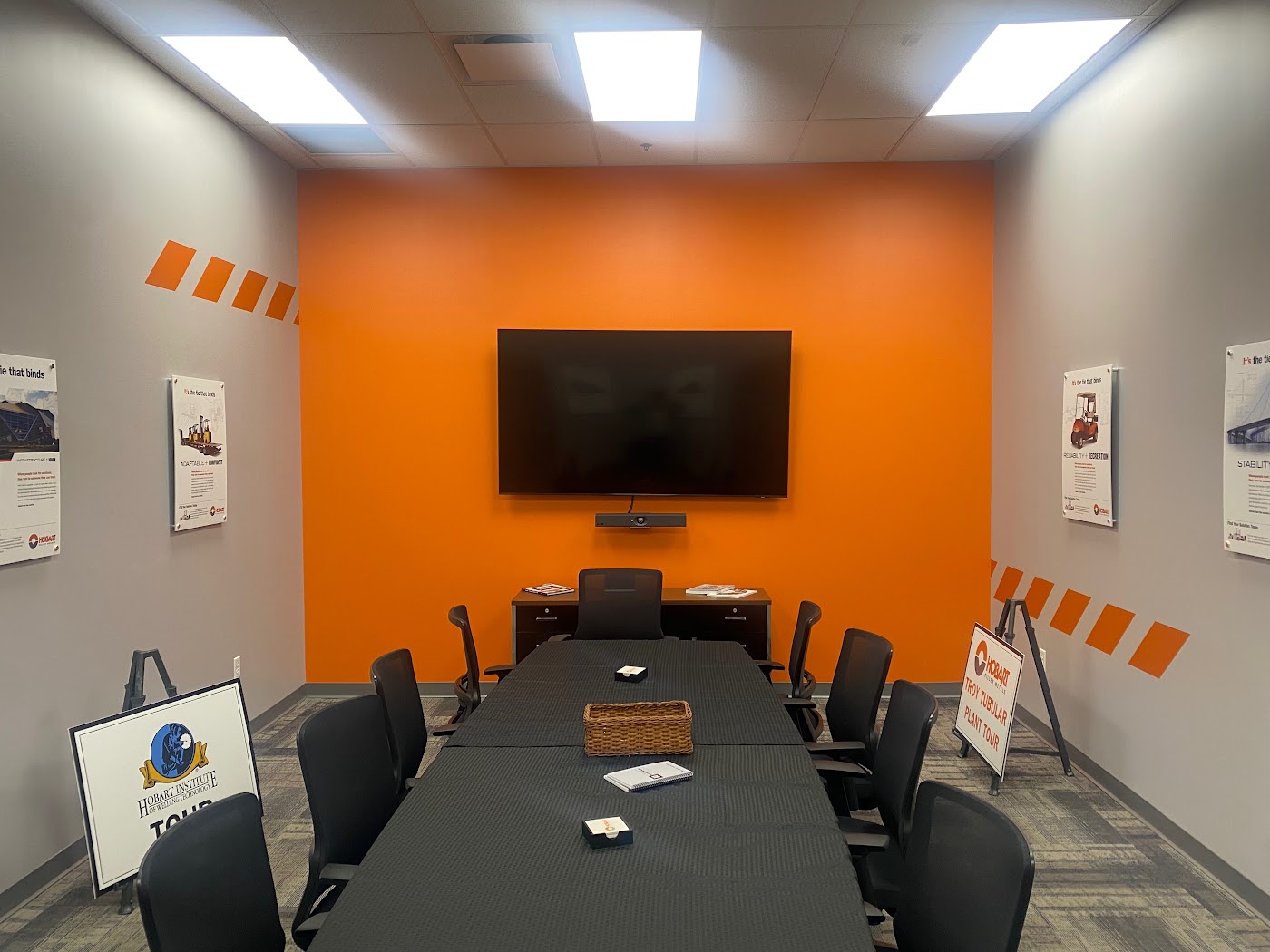 Rectangular wall signs with printed graphics and a flat screen TV in Dayton, Ohio.