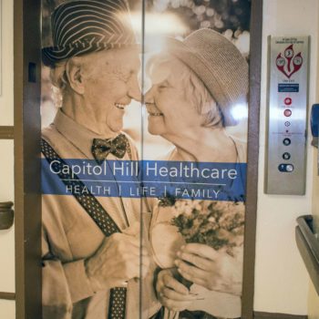 Capitol Hill Healthcare old couple elevator wrap