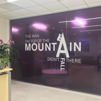 The Man on top of the Mountain Didn't Fall There conference room window graphic