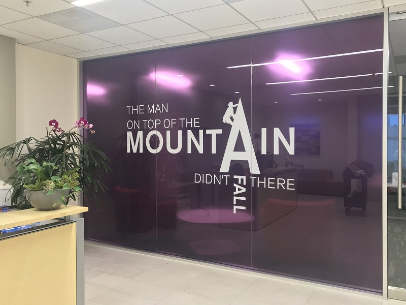 The Man on top of the Mountain Didn't Fall There conference room window graphic