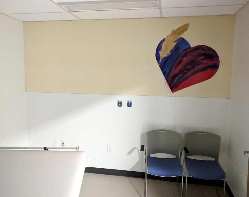 Heart wall mural in exam room children's hospital