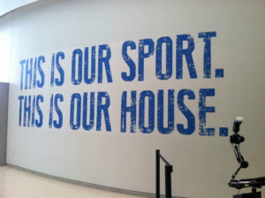 A wall mural with the words "This is our sport. This is our house".