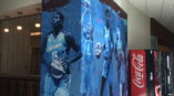 A custom wall mural showing star basketball players of the Atlanta Dream.