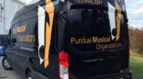 A passenger van for Purdue University with a custom vehicle wrap.