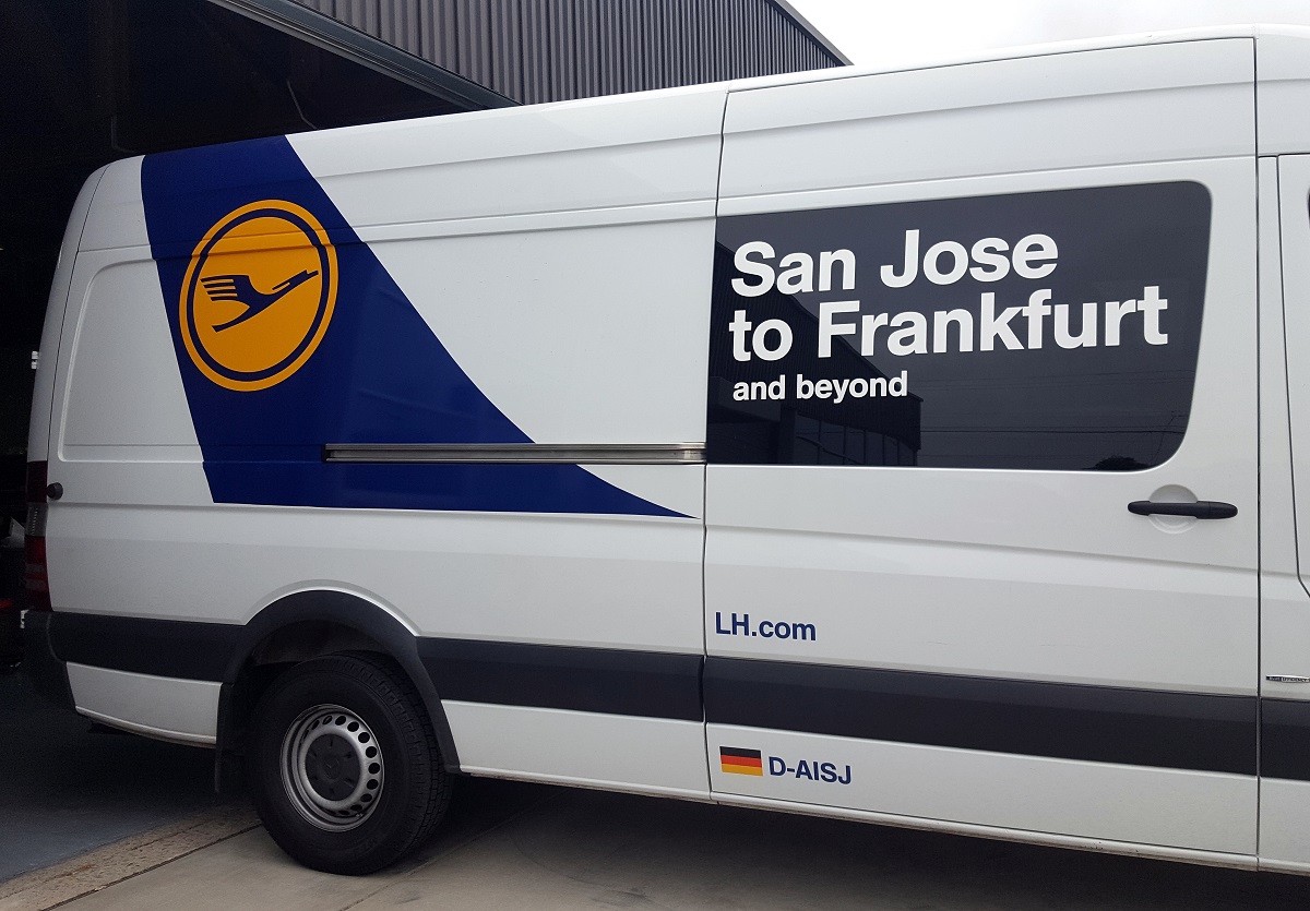 A custom vehicle wrap on a passenger van for Lufthansa.