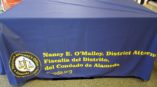 A custom table runner for the District Attorney's office of Alameda County made by Speed Pro Imaging.
