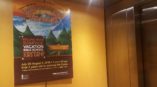 A small custom made banner for a bible school hung in an elevator.