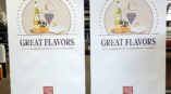 Two banner stand ads with a graphic of wine and cheeses.