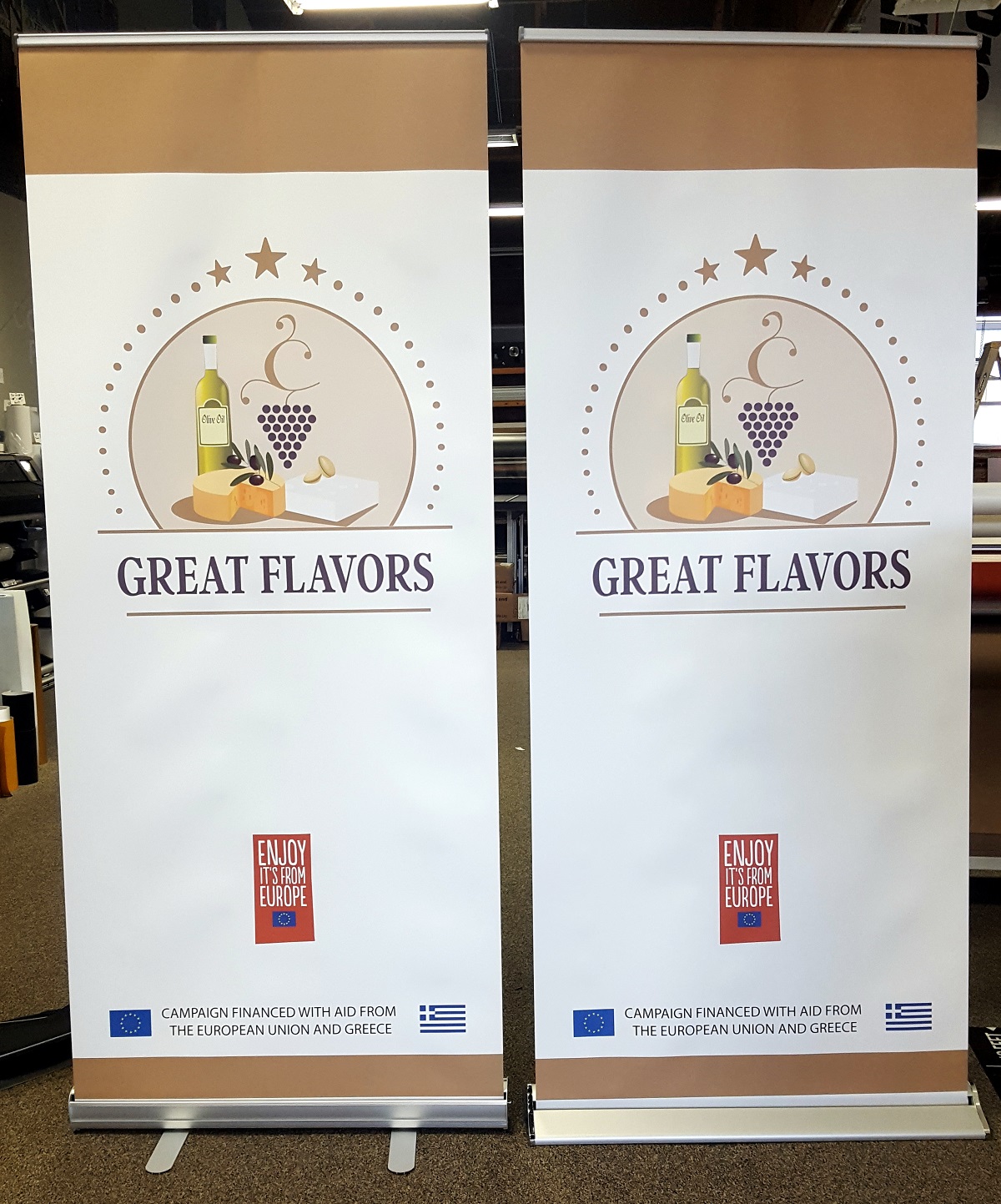 Two banner stand ads with a graphic of wine and cheeses.