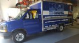 big blue plumbing box truck wrap