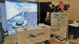 Jacobian engineering tradeshow setup with backdrop and table cover