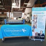 visiting angels tradeshow display with retractable banner