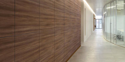 hallway in office with wood paneling mural