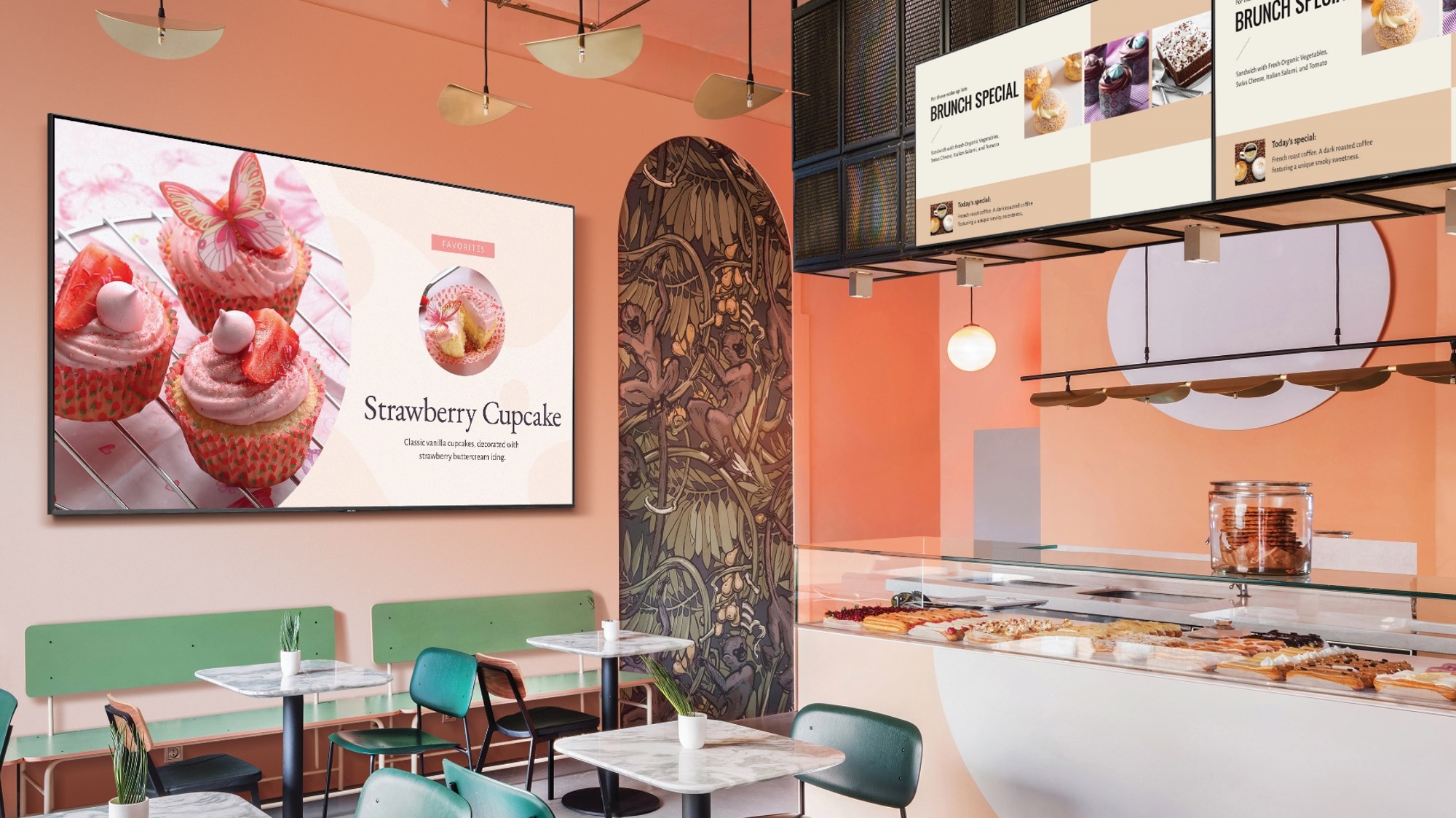 digital signage on screens featuring pastries inside empty restaurant