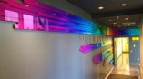 rainbow colored indoor signage in office