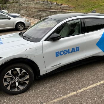 Eden Prairie, Minnesota vehicle wrap featuring a partial wrap on a grey car with blue graphics and logo for Ecolab. Vehicles Graphics and Wraps. Custom vehicle wrap installation in Eden Prairie, Minneapolis, and St. Paul by SpeedPro Imaging Fleet vehicle graphics in Bloomington, Edina, and St. Louis Park for branded company vehicles Commercial vehicle wraps in Hopkins, Minnetonka, and Excelsior for mobile advertising Vehicle graphics near me in Richfield, Golden Valley, and Maple Grove for business branding Full vehicle wraps in Rogers, Shakopee, and Chaska for high-impact advertising on the road Twin Cities fleet graphics and wraps in Chanhassen, Eden Prairie, and Prior Lake Custom van wraps in Savage, Burnsville, and Bloomington for local service businesses Truck graphics and vehicle decals in Minneapolis, St. Paul, and Maple Grove Partial vehicle wraps in Edina, St. Louis Park, and Hopkins for cost-effective branding High-impact vehicle wraps in Minnetonka, Excelsior, and Chanhassen for business promotion Fleet branding and vehicle graphics in Golden Valley, Richfield, and Savage Custom car wraps in Prior Lake, Shakopee, and Chaska for business and promotional use Twin Cities vehicle wrap services in Rogers, Maple Grove, and Burnsville Vehicle wraps near me in Eden Prairie, Minneapolis, and surrounding suburbs Commercial fleet graphics in St. Paul, Bloomington, and Edina for consistent brand visibility