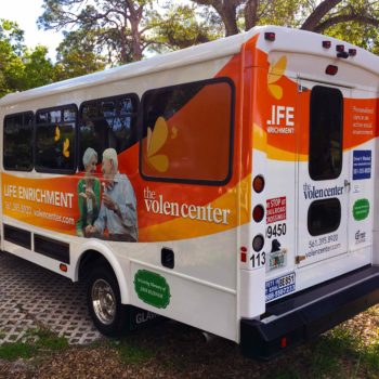 Bus with Life Enrichment vehicle wrap