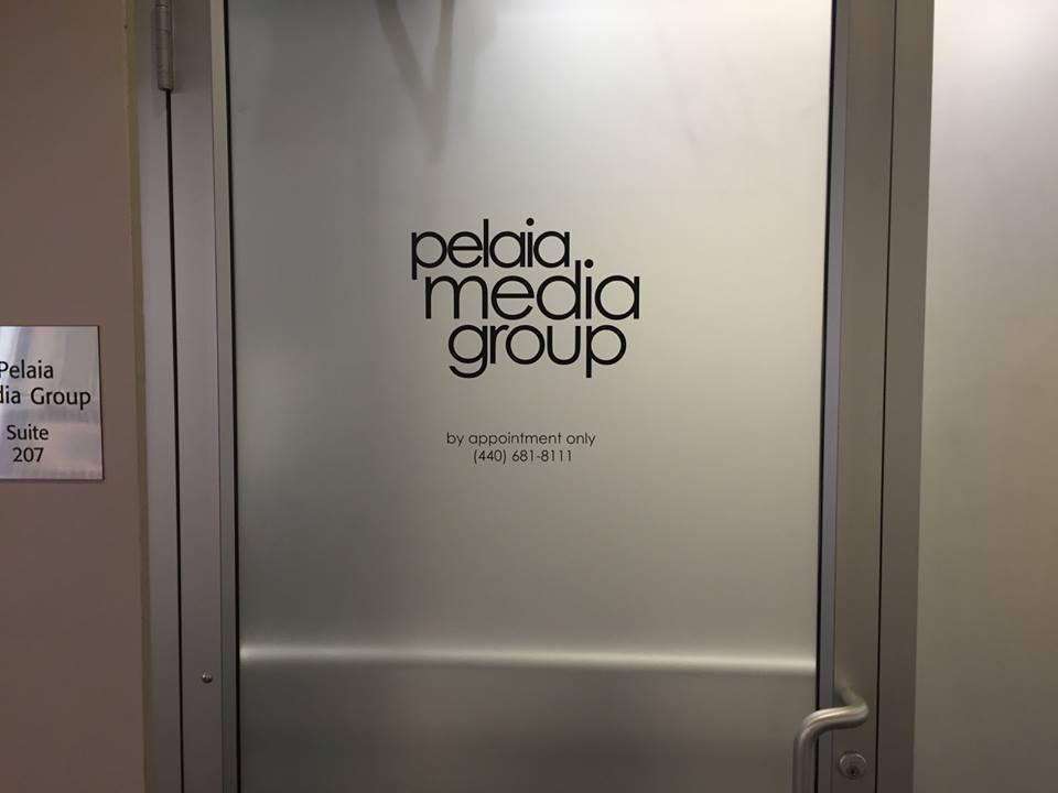 Pelaia Media Group logo on a door 