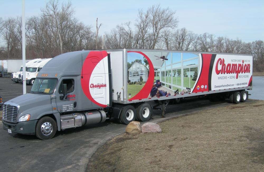 Eighteen-wheeler wrapped with graphics for the company Champion. 