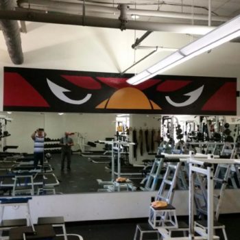 Bird face wall graphic in fitness center