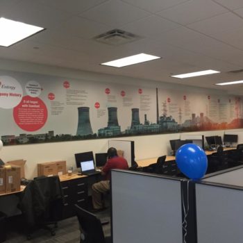 Entergy company history timeline wall graphic in office