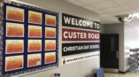 Wall decal welcoming visitors to Custer Road Christian Day School  
