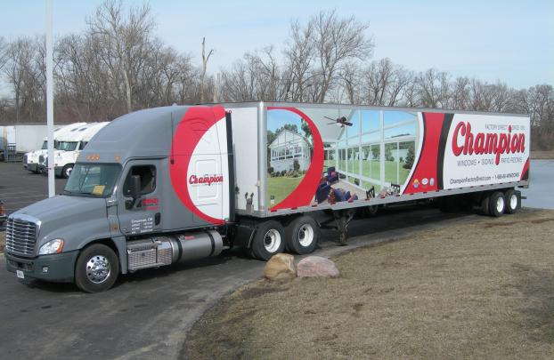 Eighteen-wheeler wrapped with custom graphics for Champion. 