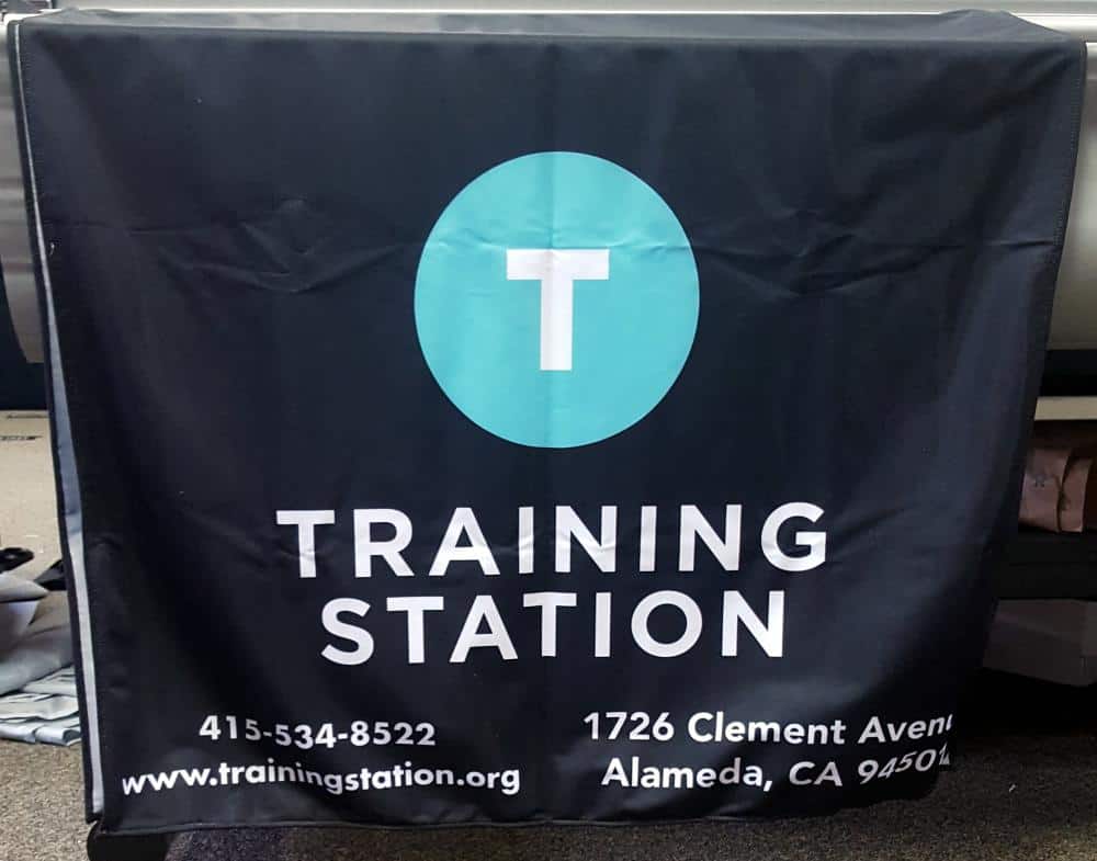 colorful table banner featuring training station design elements