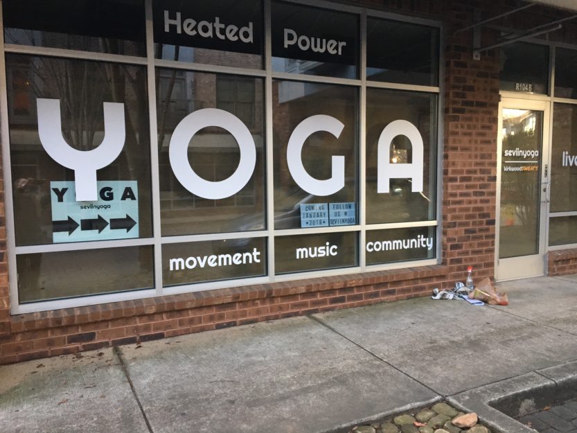 Seviin Yoga yoga glass wall graphic 