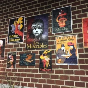 Movie posters graphics over brick 