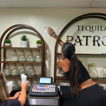 Cut vinyl decals being installed for Tequila Patron