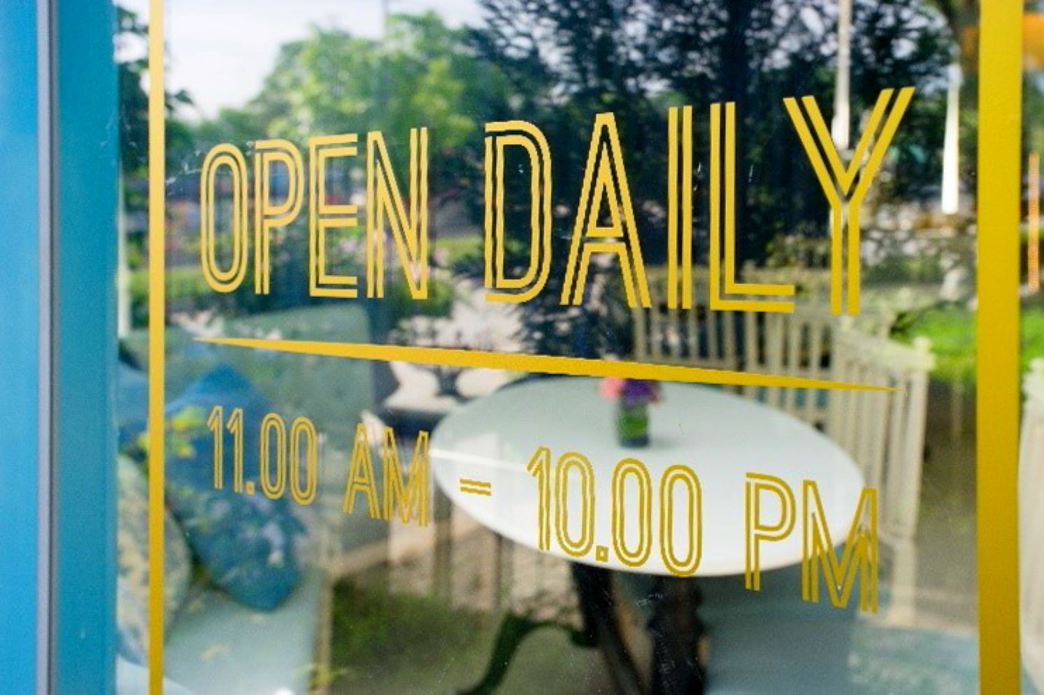 vinyl lettering showing hours of operation