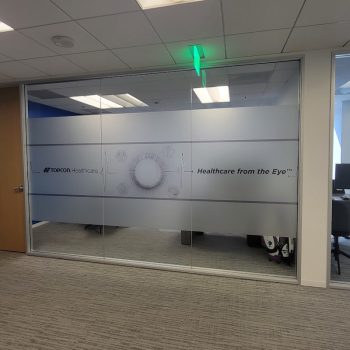Frosted window graphics with printed designs on glass office partition in San Diego, CA.