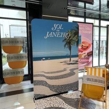 Freestanding fabric banner and large product replica display for retail signage in San Diego, CA.