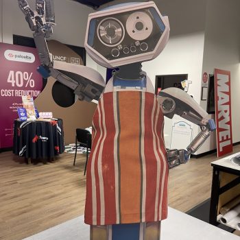 Freestanding cutout sign of a robot wearing an apron displayed indoors in San Diego, CA.