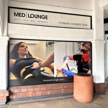 Window graphics on storefront featuring medical treatment images in San Diego, CA.