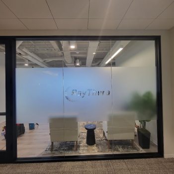 Frosted window film with clear cut lettering applied on glass office partition in San Diego, CA.