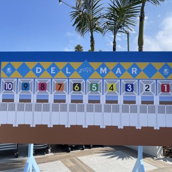 Large outdoor vinyl banner with colorful numbered panels and graphics on stand in San Diego, CA.