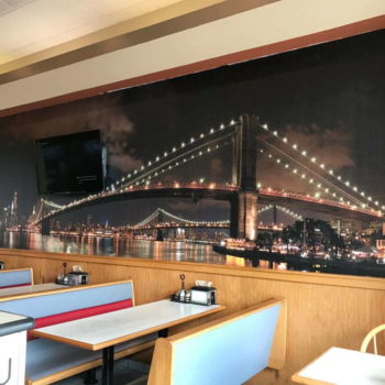 restaurant wall mural of a bridge at night 