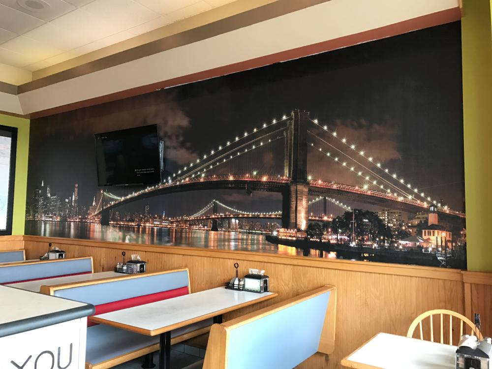 restaurant wall mural of a bridge at night 