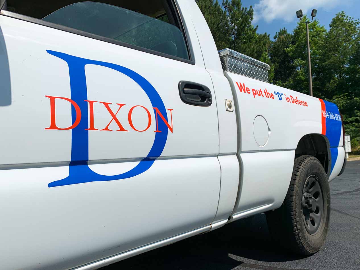 Truck logo, phone and slogan lettering.