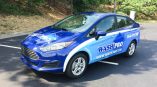 Wash Pro full sedan wrap with two tones of blue, logos, contact info and services.