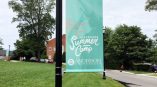 Flag banner displaying Anderson's summer camp program.