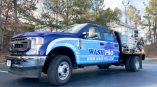 Wash Pro's second flatbed cab wrap with two tones of blue, logos, contact info and services.